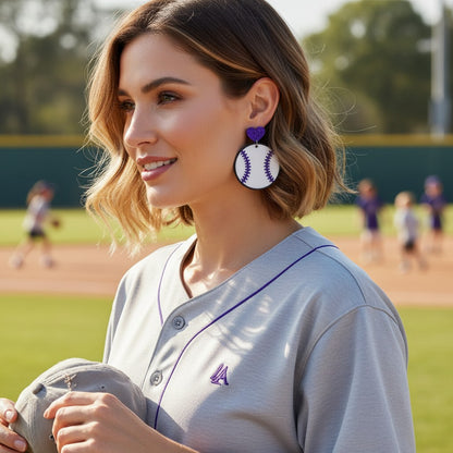 Trulyolive purple glitter heart baseball dangle earrings with white and purple stitching.